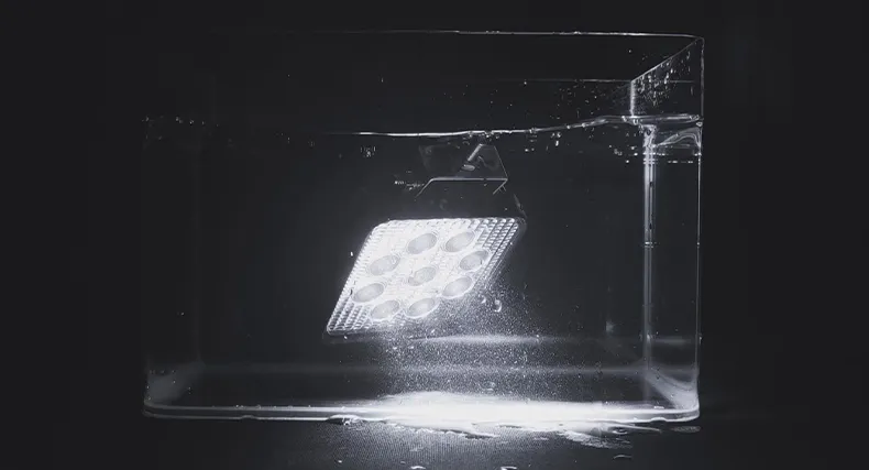 Sealed waterproof LED working light built for repeated water exposure on industrial equipment