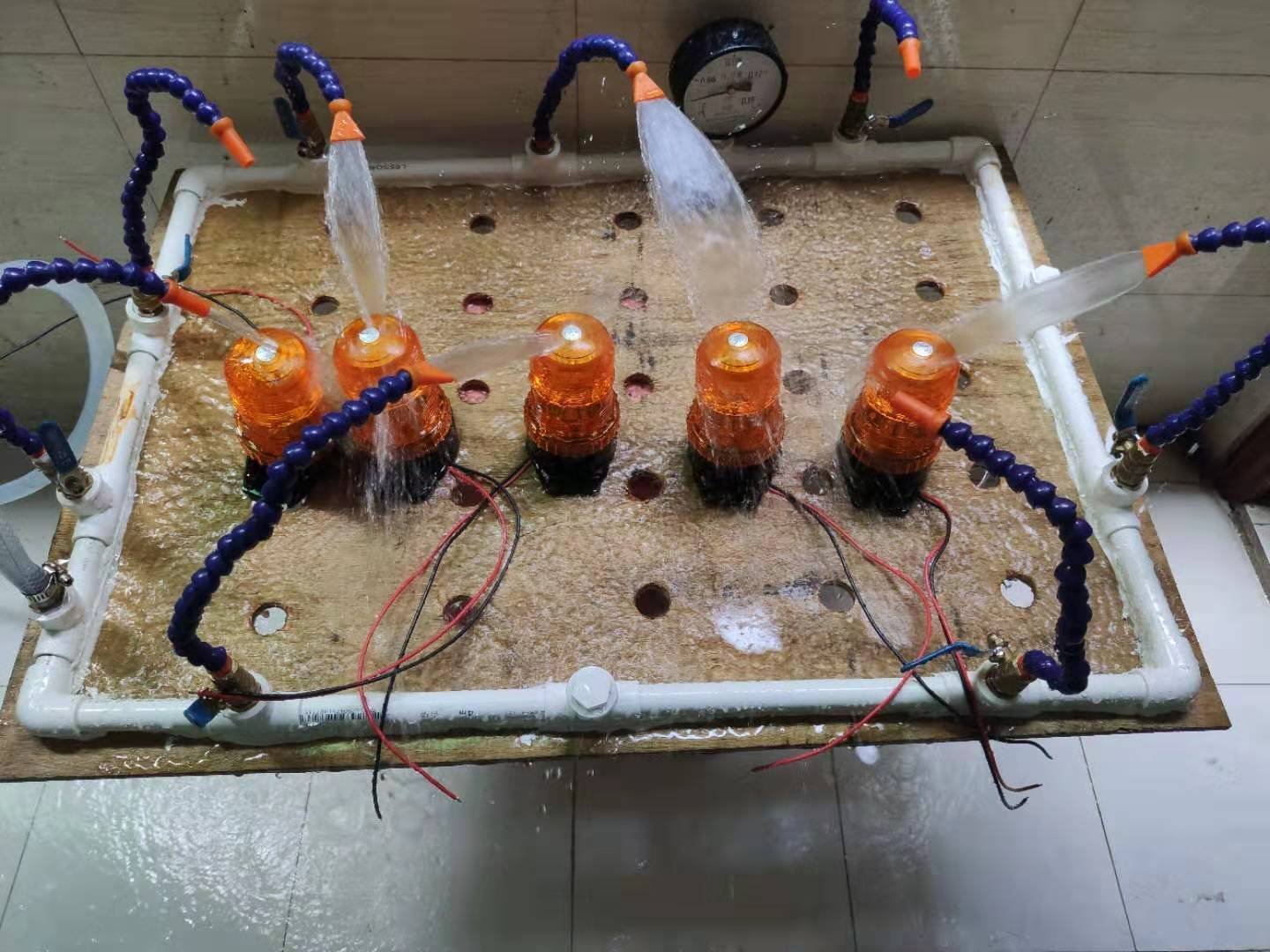 Forklift light housing under water during IP68 sealing verification on the XRLL production line