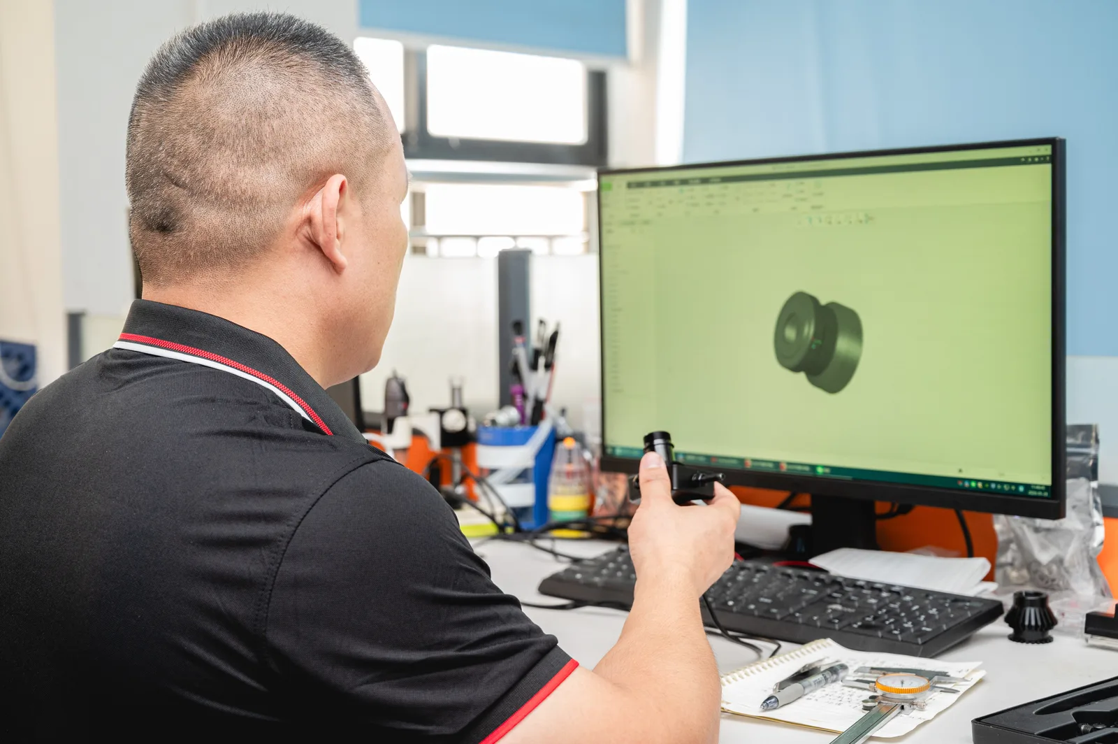 XRLL engineer at CAD quality inspection station