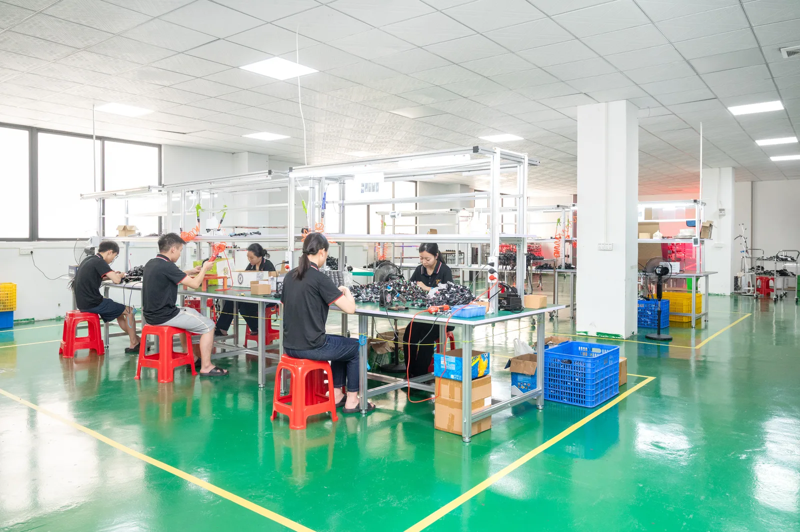 LED assembly line workers in XRLL workshop