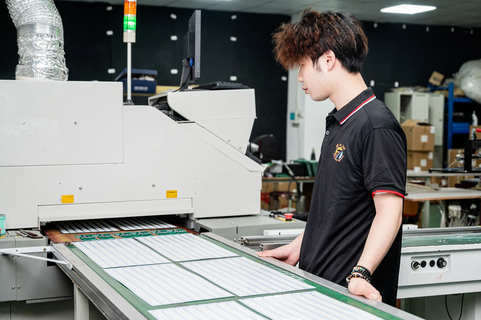 Reflow oven on the LED PCB production line during circuit board assembly